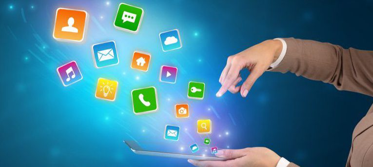 Hand holding tablet and application icons falling inwards