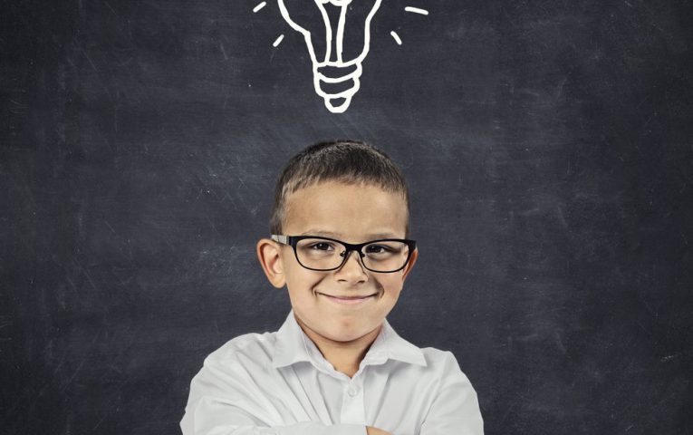 Big idea. Smart boy with solution lightbulb above head